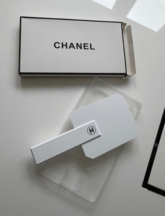 White handheld mirror