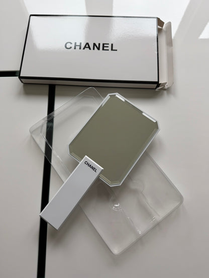 White handheld mirror