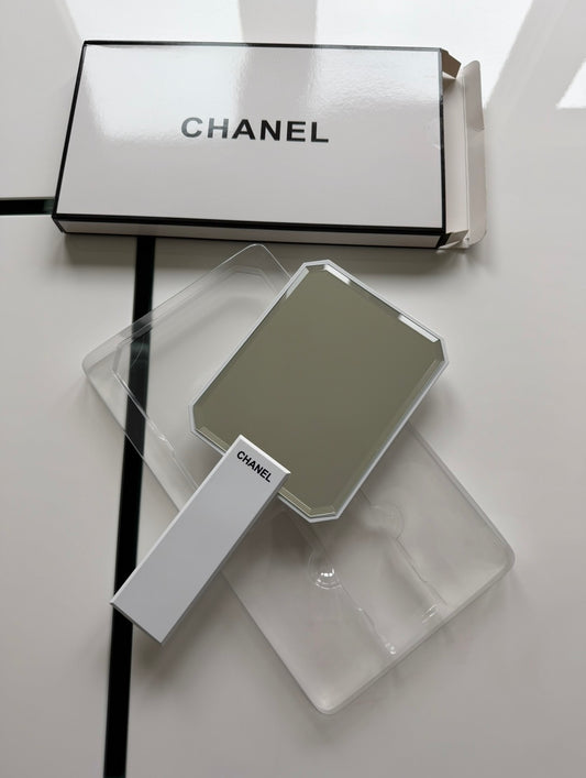 White handheld mirror
